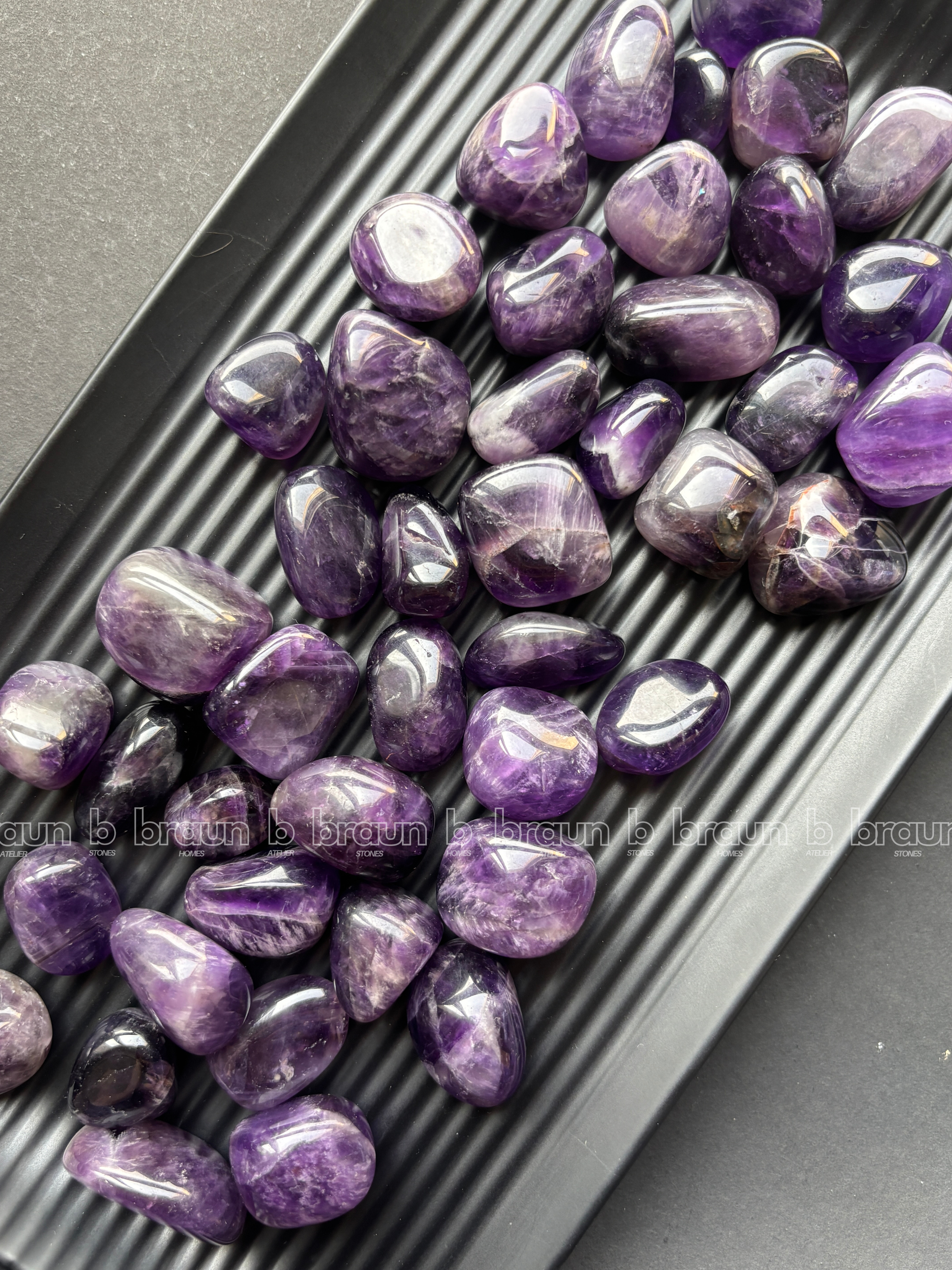 Natural amethyst tumbled crystals by Braun Homes polished healing stones for meditation, Reiki, chakra balancing, anxiety relief, and spiritual energy protection in deep purple hues