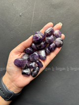 Natural amethyst tumbled crystals by Braun Homes polished healing stones for meditation, Reiki, chakra balancing, anxiety relief, and spiritual energy protection in deep purple hues