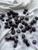 Natural amethyst tumbled crystals by Braun Homes polished healing stones for meditation, Reiki, chakra balancing, anxiety relief, and spiritual energy protection in deep purple hues