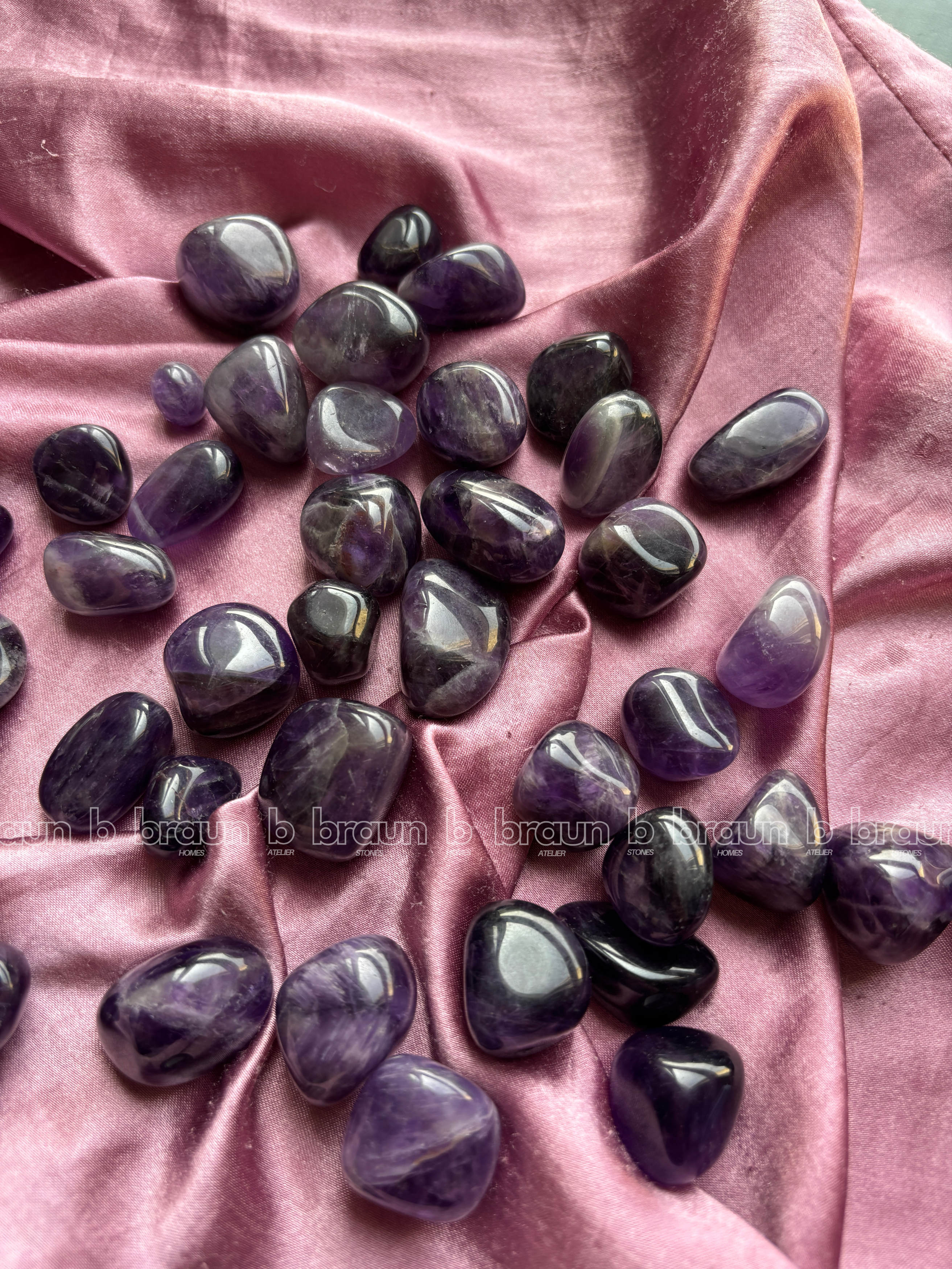 Natural amethyst tumbled crystals by Braun Homes polished healing stones for meditation, Reiki, chakra balancing, anxiety relief, and spiritual energy protection in deep purple hues