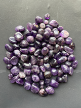 Natural amethyst tumbled crystals by Braun Homes polished healing stones for meditation, Reiki, chakra balancing, anxiety relief, and spiritual energy protection in deep purple hues
