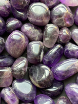 Natural amethyst tumbled crystals by Braun Homes polished healing stones for meditation, Reiki, chakra balancing, anxiety relief, and spiritual energy protection in deep purple hues