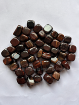 NaturalRed Tiger Eye tumbled crystals by Braun Homes √ê polished healing stones for meditation, Reiki, chakra balancing, anxiety relief, and spiritual energy protection in deep purple hues