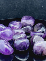 Natural amethyst tumbled crystals by Braun Homes polished healing stones for meditation, Reiki, chakra balancing, anxiety relief, and spiritual energy protection in deep purple hues
